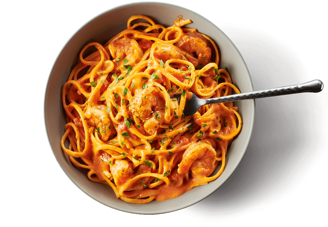 a bowl of cajun shrimp pasta
